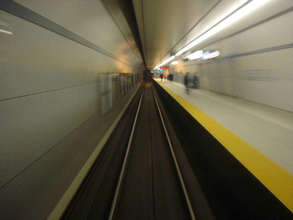 The inside of a tube station showing a train track